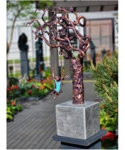 Copper tree sculpture with child on swing, outdoor art installation at The Kildare Gallery, beautiful contemporary metal artwork.