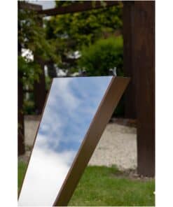 Shallow reflective mirror sculpture at The Kildare Gallery outdoor exhibit.