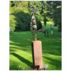 Intricate metal sculpture displayed outdoors in Kildare garden.