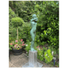 Bronze garden sculpture of a nude woman in lush greenery, highlighting outdoor art at The Kildare Gallery.
