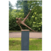 Modern bronze sculpture of a dancer performing a leap, outdoors at The Kildare Gallery.