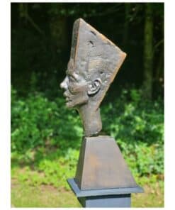 Contemporary bronze sculpture of a man's profile with a geometric head shape, situated outdoors at The Kildare Gallery.