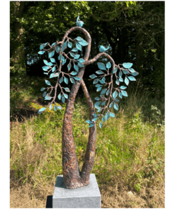 Rusted metal tree sculpture with blue leaves outdoor art installation.