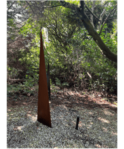 Metal sculpture in lush garden at The Kildare Gallery, showcasing contemporary outdoor art.