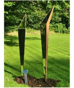 Reflective outdoor sculpture at The Kildare Gallery, contemporary art piece in lush garden setting.