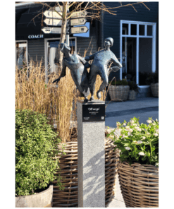 Off we go sculpture by Bob Quinn at The Kildare Gallery, outdoor garden art piece in a landscaped setting.