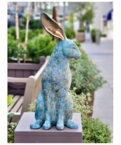 Whimsical blue hare sculpture with metallic ear detail, displayed outdoors at The Kildare Gallery.