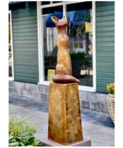Elegant bronze sculpture of a stylised cat sitting on a pedestal, displayed outside The Kildare Gallery.