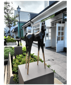 Elegant horse sculpture outside The Kildare Gallery, showcasing contemporary art in a scenic shopping district.