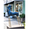 Blue ceramic horse sculpture with gold accents at The Kildare Gallery.